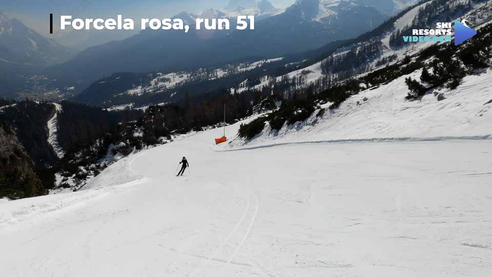 It curves between dolomite towers with a panoramic view of Ampezzo valley.