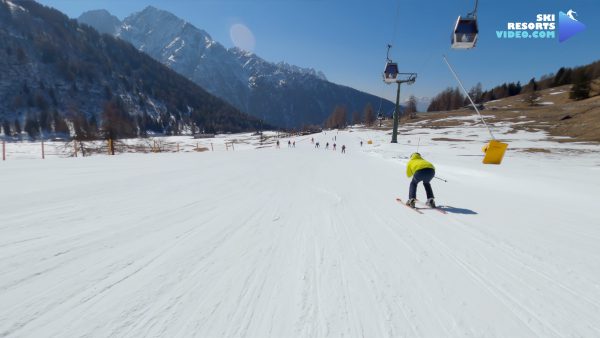 a west face scenic red run that goes to either the mid-station of  Ponte di Legno-Tonale gondola